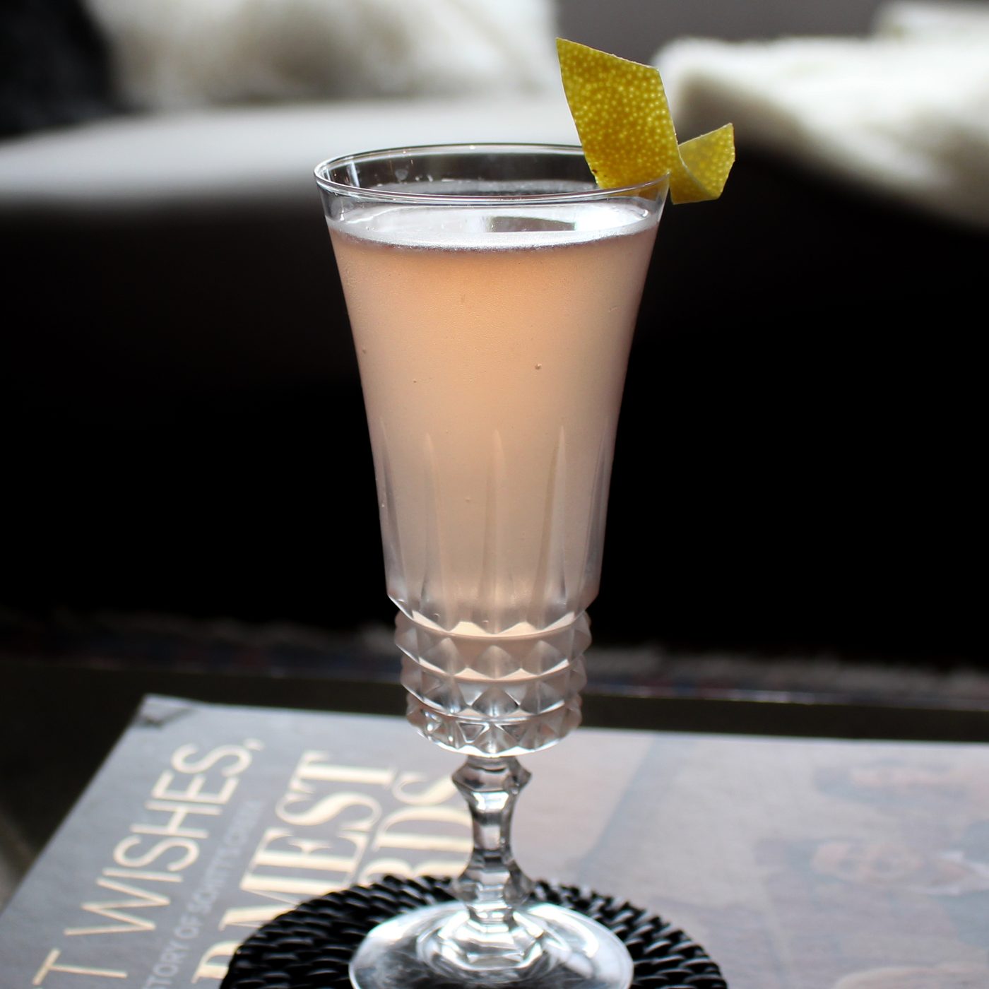 Cocktail served with a fresh lemon wheel
