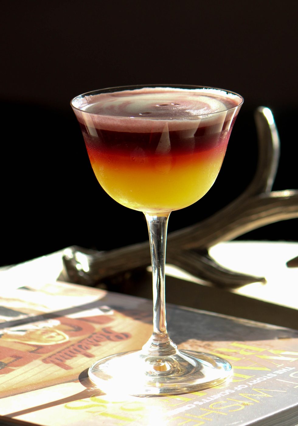 Craft cocktail with a citrus wheel garnish