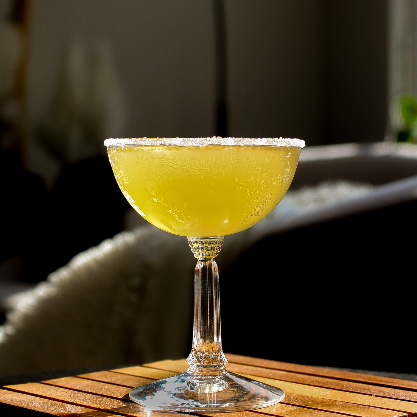 Signature cocktail with a salted rim, natural light