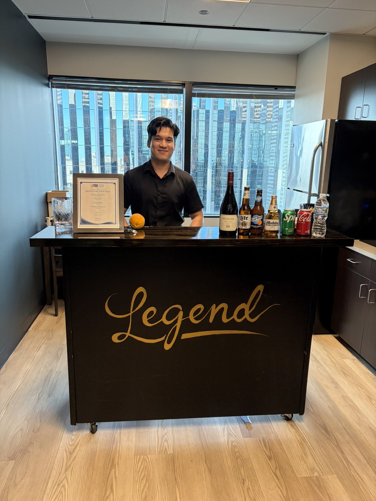 Legend Mobile Bar branded portable bar set up in a Chicago office with skyline windows