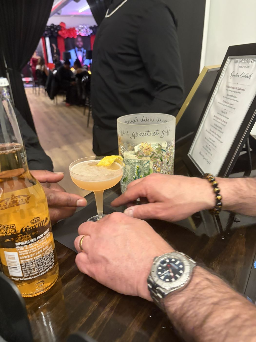 Birthday party guests enjoying cocktails from the Legend bar