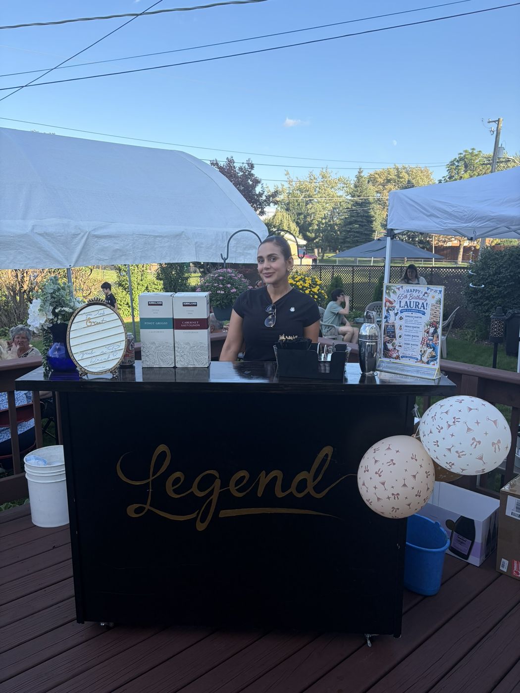 Bartender crafting cocktails at a private celebration