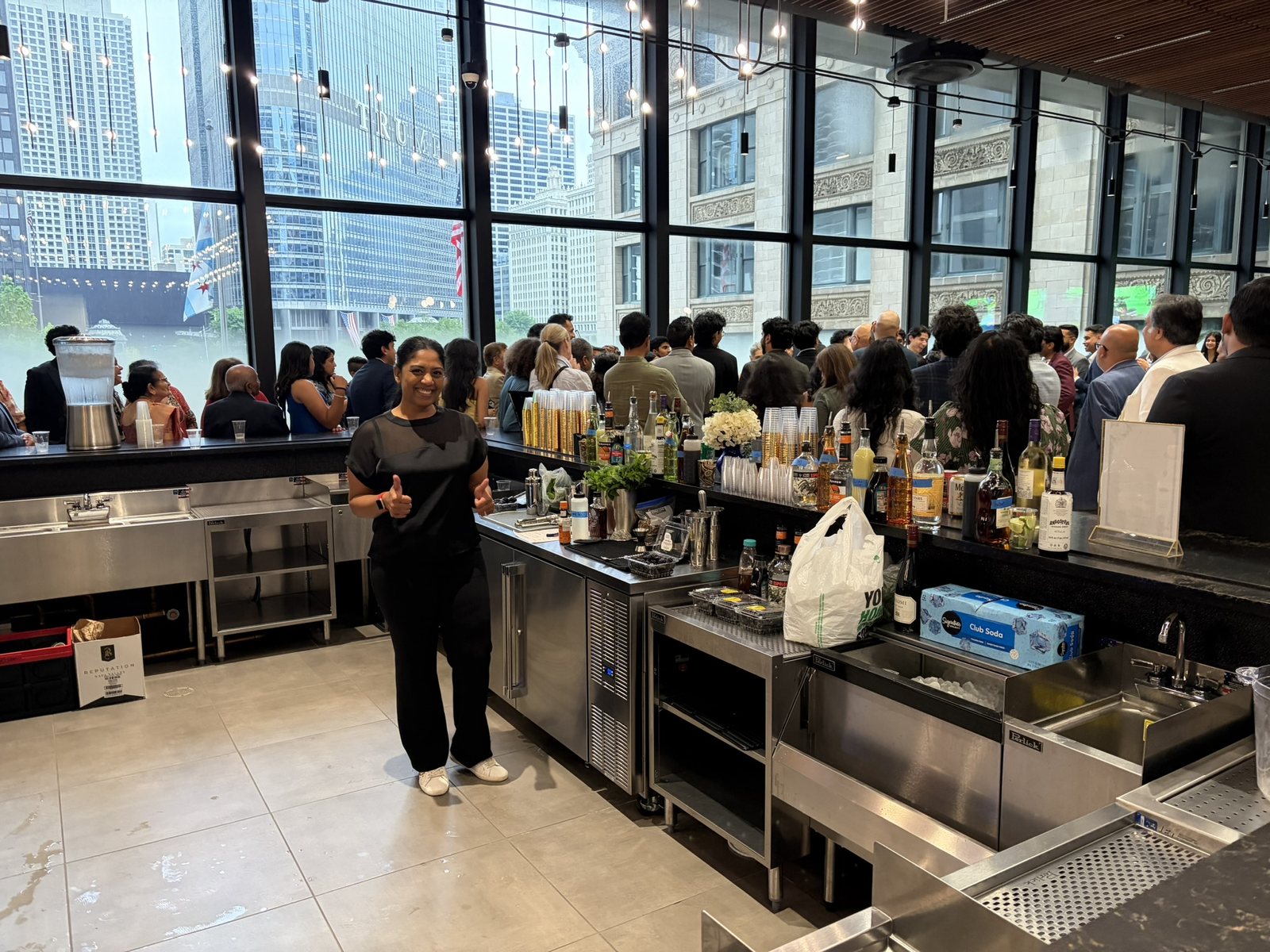 Mobile bartender working a wedding reception bar with a Chicago skyline view